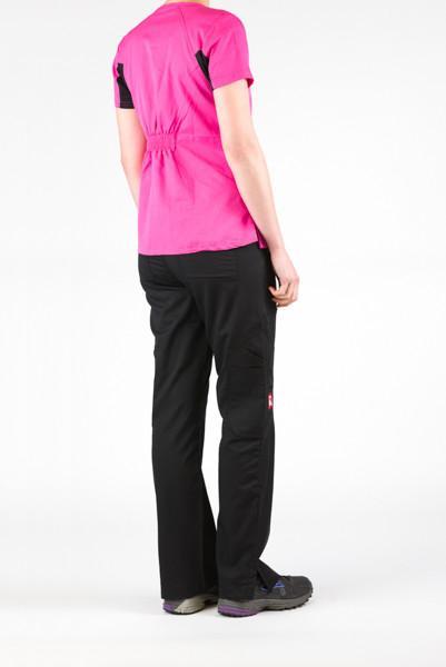 Women's Ultra Flex 4-pocket Scrub Top in pink on model wearing black flex scrub pants view from behind side angle