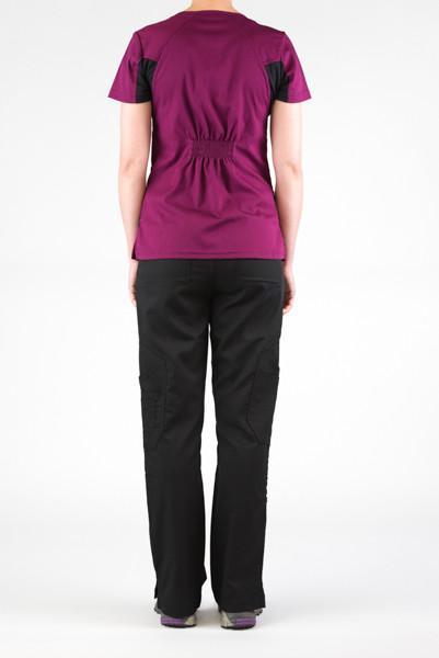 Women's Ultra Flex 4-pocket Scrub Top in wine on model wearing black flex scrub pants view from behind