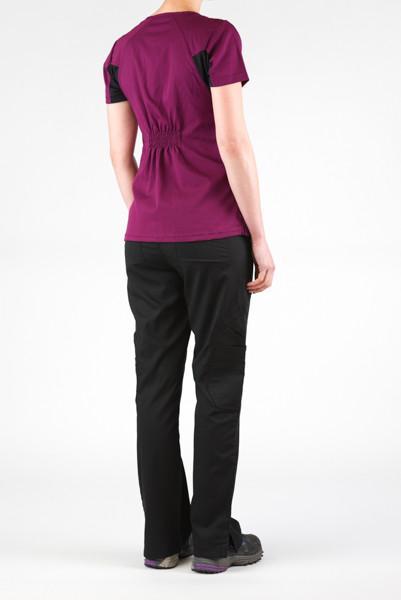Women's Ultra Flex 4-pocket Scrub Top in wine on model wearing black flex scrub pants view from behind at angle