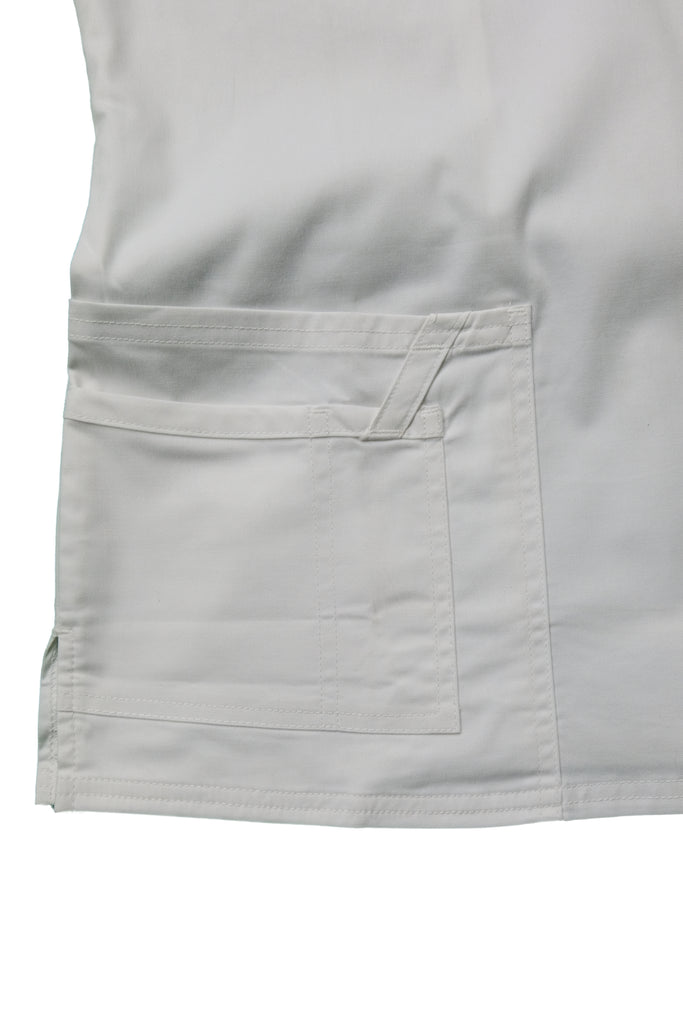 Women's Tailored 4-Pocket V-Neck Scrub Top in White closeup on pockets with utility loop